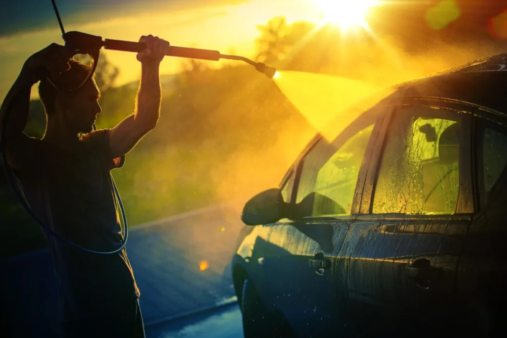 washing car under strong evening sunlight