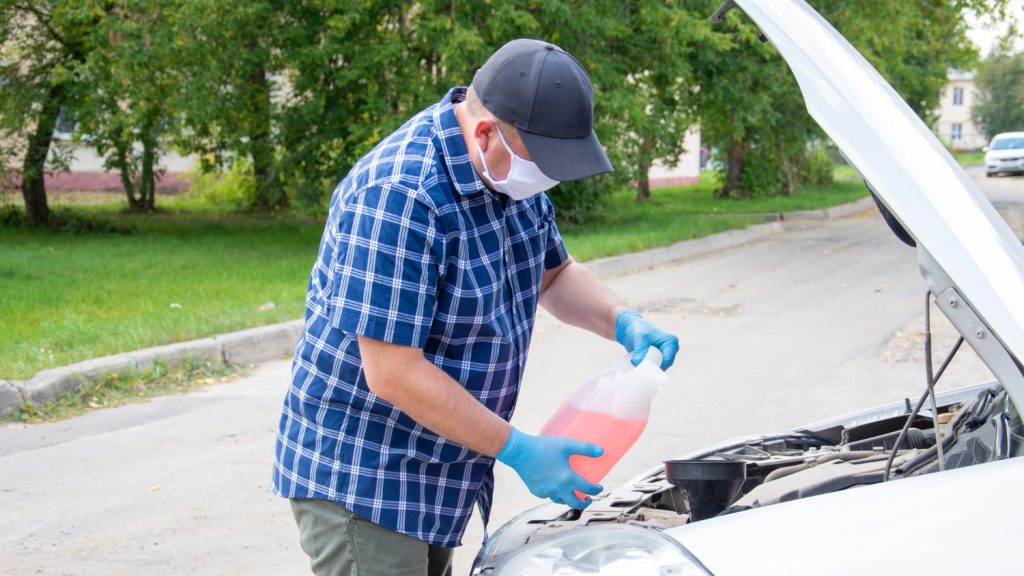 Man washing car with detergent