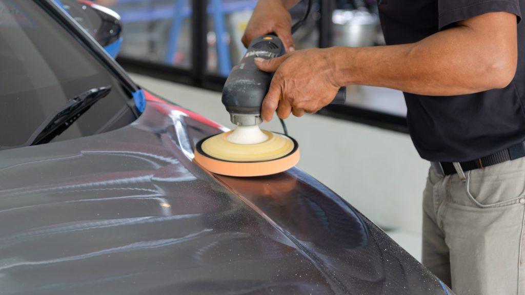 Machine polishing car paint carefully