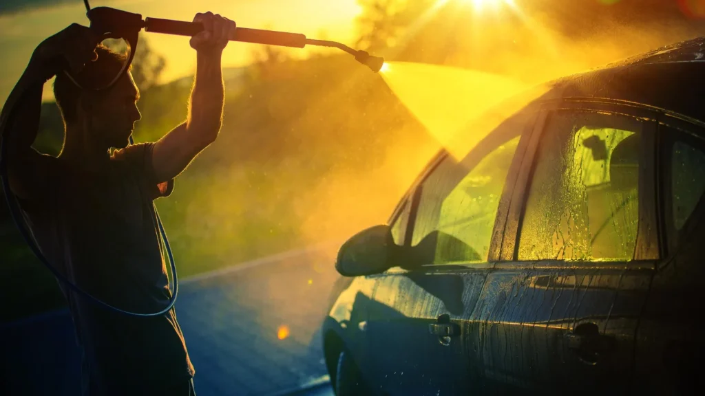 washing car under strong evening sunlight